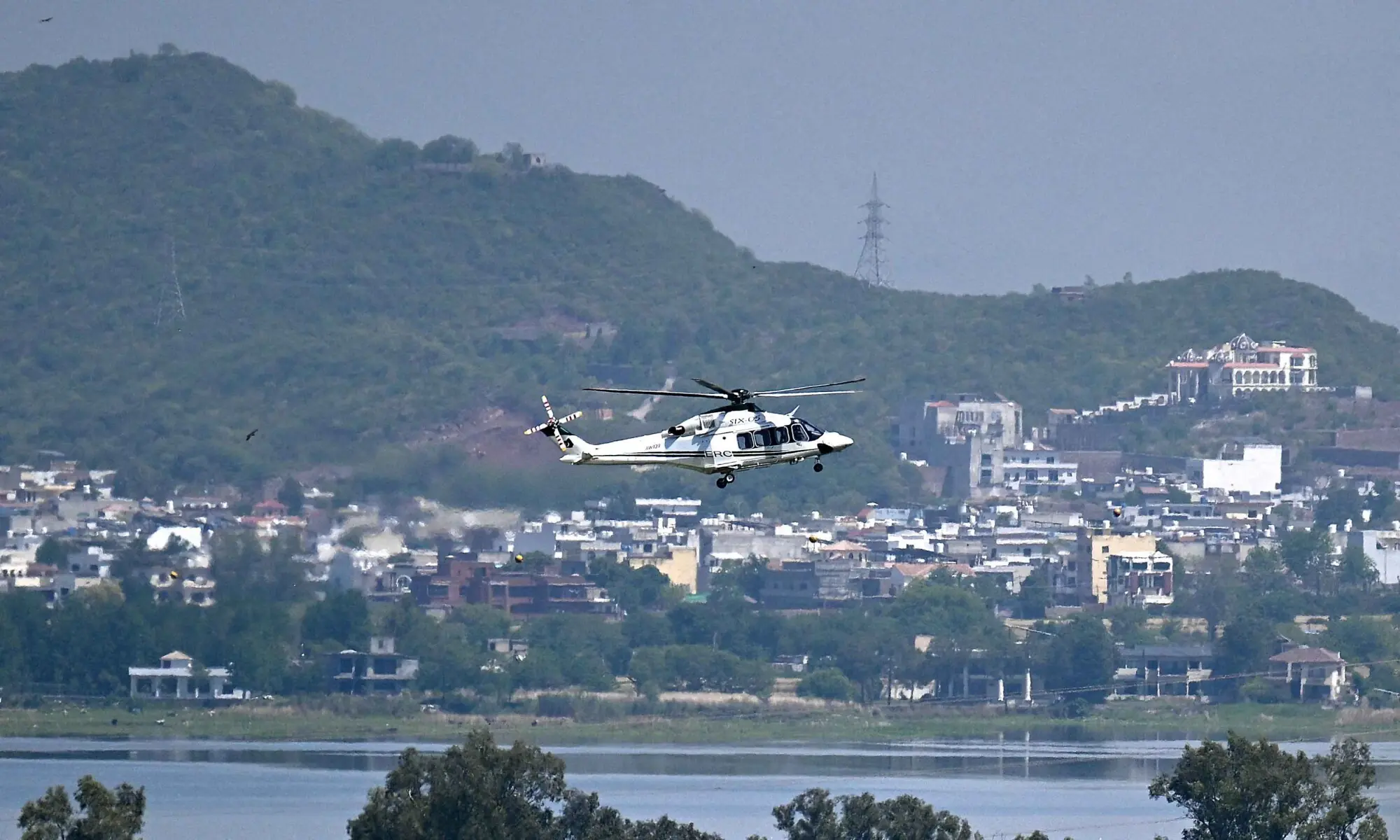 A helicopter flies over the Red Zone area in Islamabad on April 20, 2026. &mdash; AFP