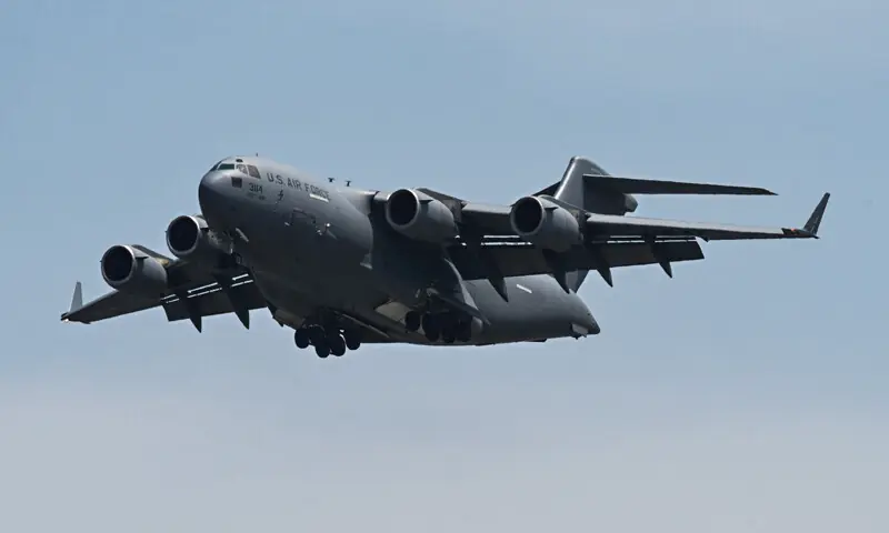A US Air Force Boeing C-17A makes final approach before landing at Nur Khan Airbase. &mdash; AFP