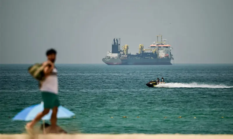 A commercial vessel is seen off the coast of Dubai. Oil prices jumped after witnessing a sharp decline on Friday.—AFP A commercial vessel is seen off the coast of Dubai. Oil prices jumped after witnessing a sharp decline on Friday.—AFP