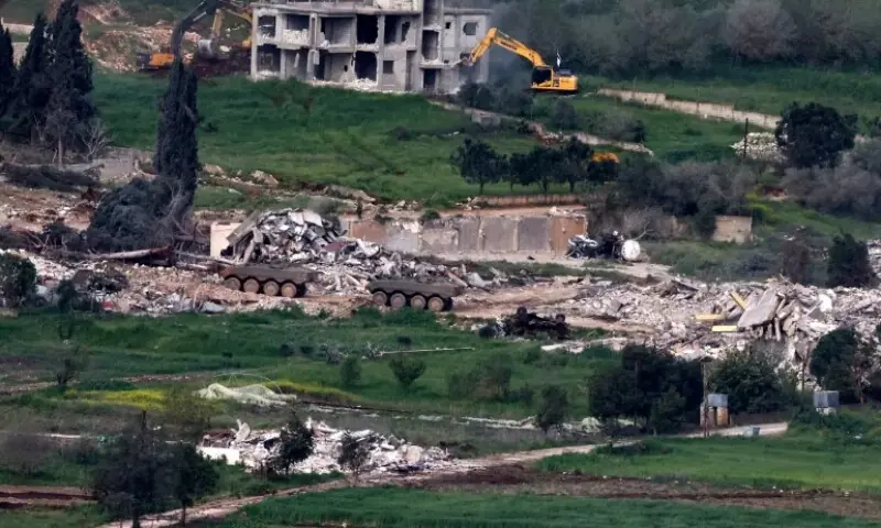 Israeli army armoured vehicles and excavators demolishing houses in the southern Lebanese village of Mais al-Jabal, on April 17, 2026. &mdash;AFP