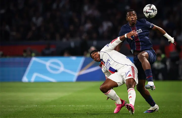 PARIS: Olympique Lyonnais’ Endrick (L) fights for the ball with Paris Saint-Germain’s Willian Pacho during their Ligue 1 match at Parc des Princes.—AFP PARIS: Olympique Lyonnais’ Endrick (L) fights for the ball with Paris Saint-Germain’s Willian Pacho during their Ligue 1 match at Parc des Princes.—AFP