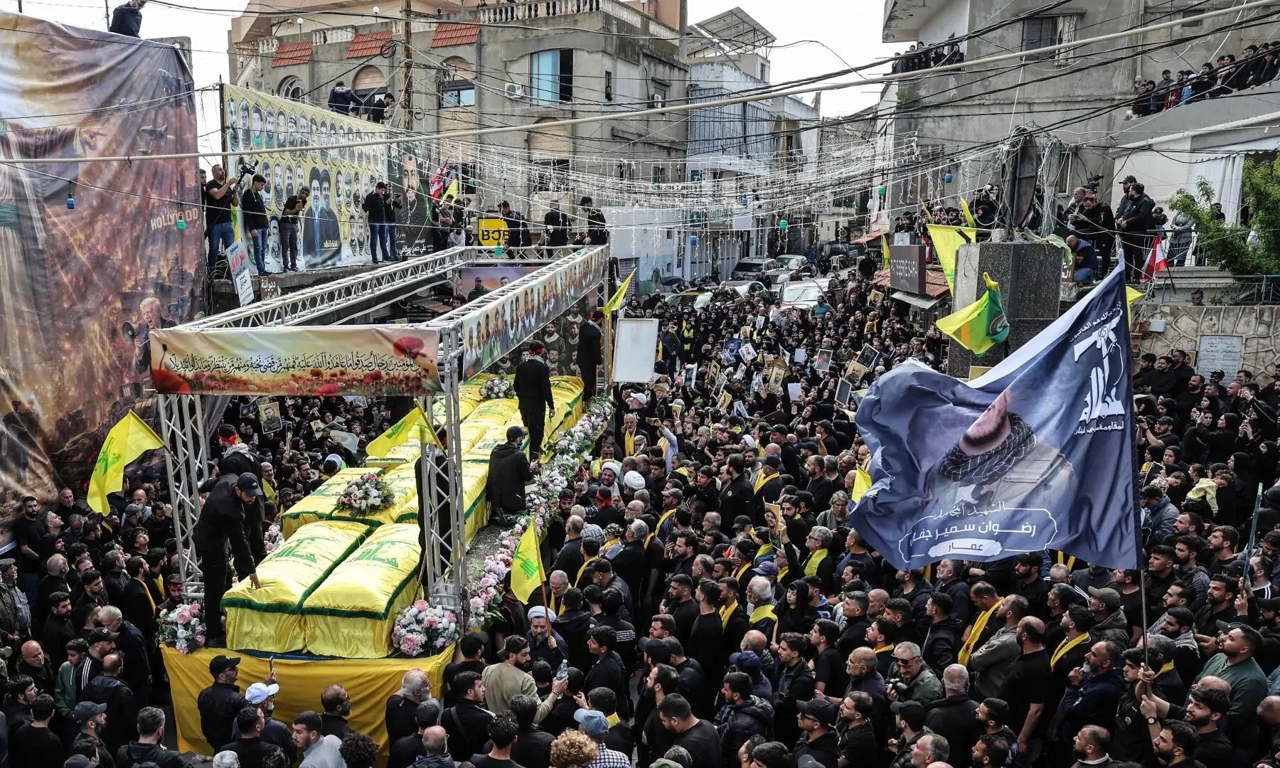 Mourners attend a mass funeral procession for Hezbollah fighters, killed before a 10-day ceasefire was agreed between the group and Israel, in the southern Lebanese village of Kfar Sir on April 21, 2026. — AFP