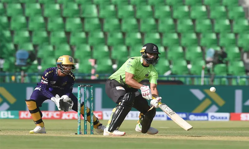 LAHORE Qalandars opener Fakhar Zaman eyes a scoop shot as Quetta Gladiators wicket-keeper Khawaja Nafay looks on during the Pakistan Super League match at the Gaddafi Stadium on Tuesday.—Murtaza Ali/White Star LAHORE Qalandars opener Fakhar Zaman eyes a scoop shot as Quetta Gladiators wicket-keeper Khawaja Nafay looks on during the Pakistan Super League match at the Gaddafi Stadium on Tuesday.—Murtaza Ali/White Star