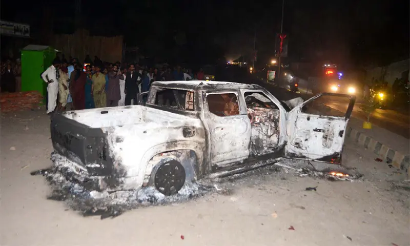 THE charred vehicle is seen after it was torched by a mob following the incident.—Umair Ali THE charred vehicle is seen after it was torched by a mob following the incident.—Umair Ali
