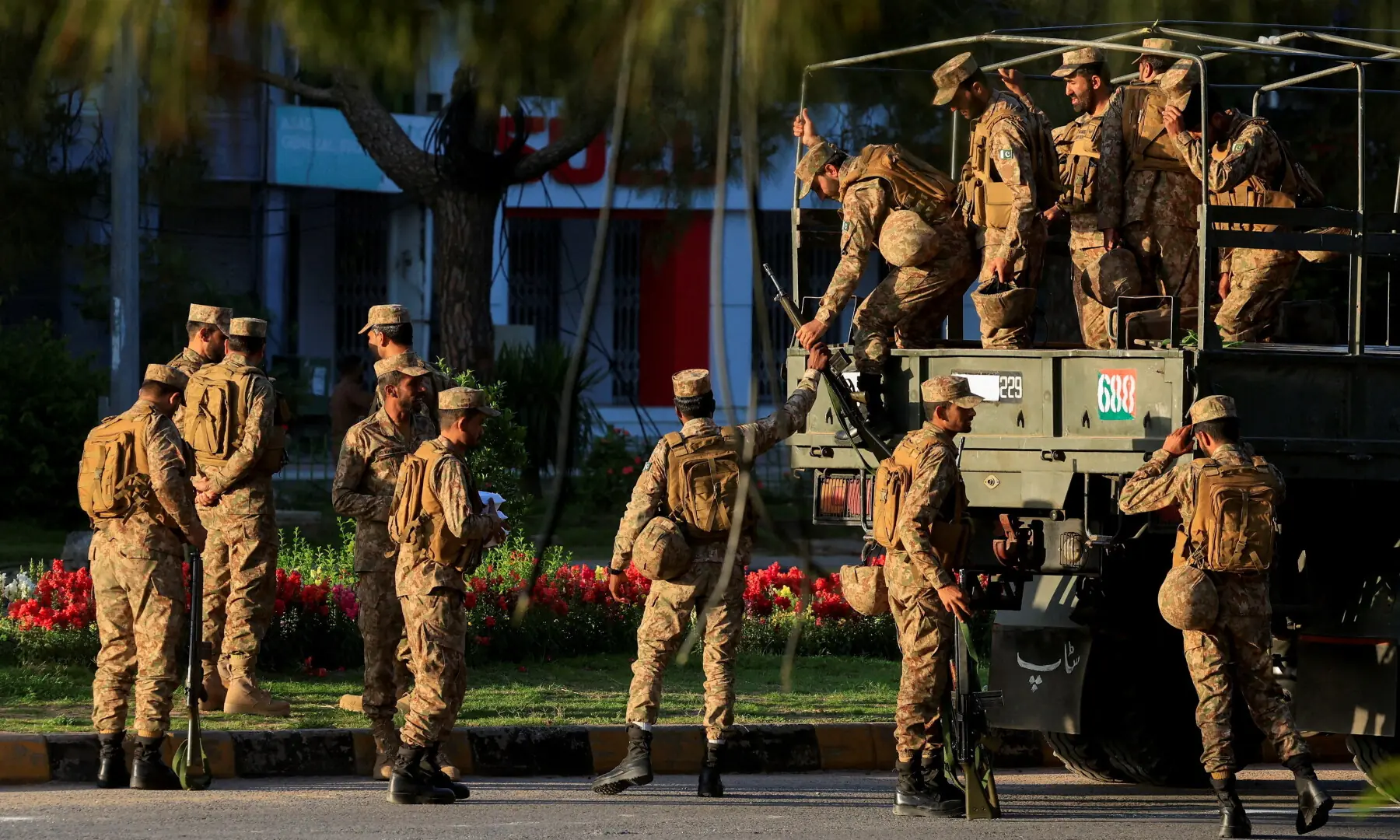 Army personnel disembark from a truck as they arrive at D Chowk near the President’s House, as Pakistan prepares to host the US and Iran for the second phase of peace talks in Islamabad on April 22, 2026. — Reuters Army personnel disembark from a truck as they arrive at D Chowk near the President’s House, as Pakistan prepares to host the US and Iran for the second phase of peace talks in Islamabad on April 22, 2026. — Reuters