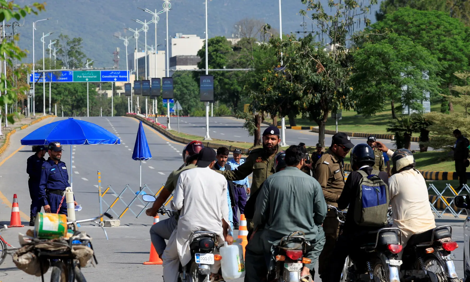 Policemen divert bikers from a road leading to Serena Hotel, as Pakistan prepares to host the US and Iran for the second phase of peace talks, in Islamabad on April 22, 2026. — Reuters Policemen divert bikers from a road leading to Serena Hotel, as Pakistan prepares to host the US and Iran for the second phase of peace talks, in Islamabad on April 22, 2026. — Reuters