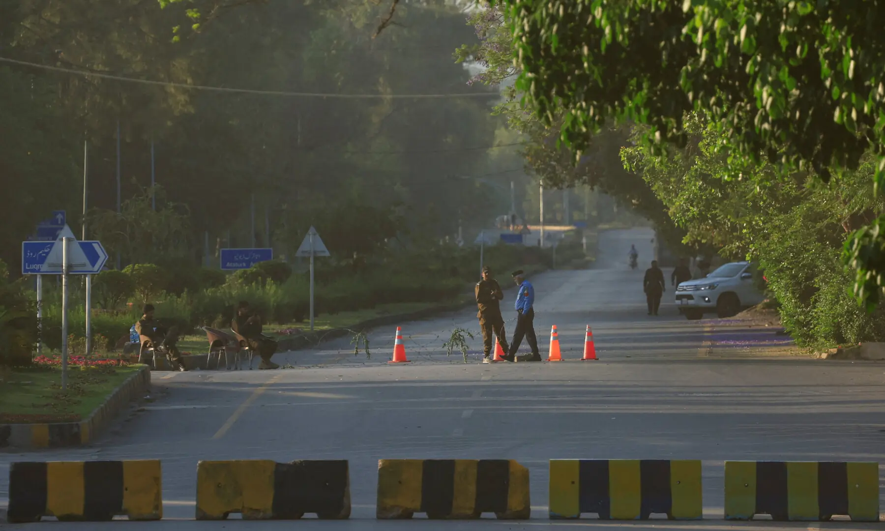 Police officers stand guard next to a blockade near the President’s House as Pakistan prepares to host the US and Iran for the second phase of peace talks in Islamabad on April 22, 2026. — Reuters Police officers stand guard next to a blockade near the President’s House as Pakistan prepares to host the US and Iran for the second phase of peace talks in Islamabad on April 22, 2026. — Reuters