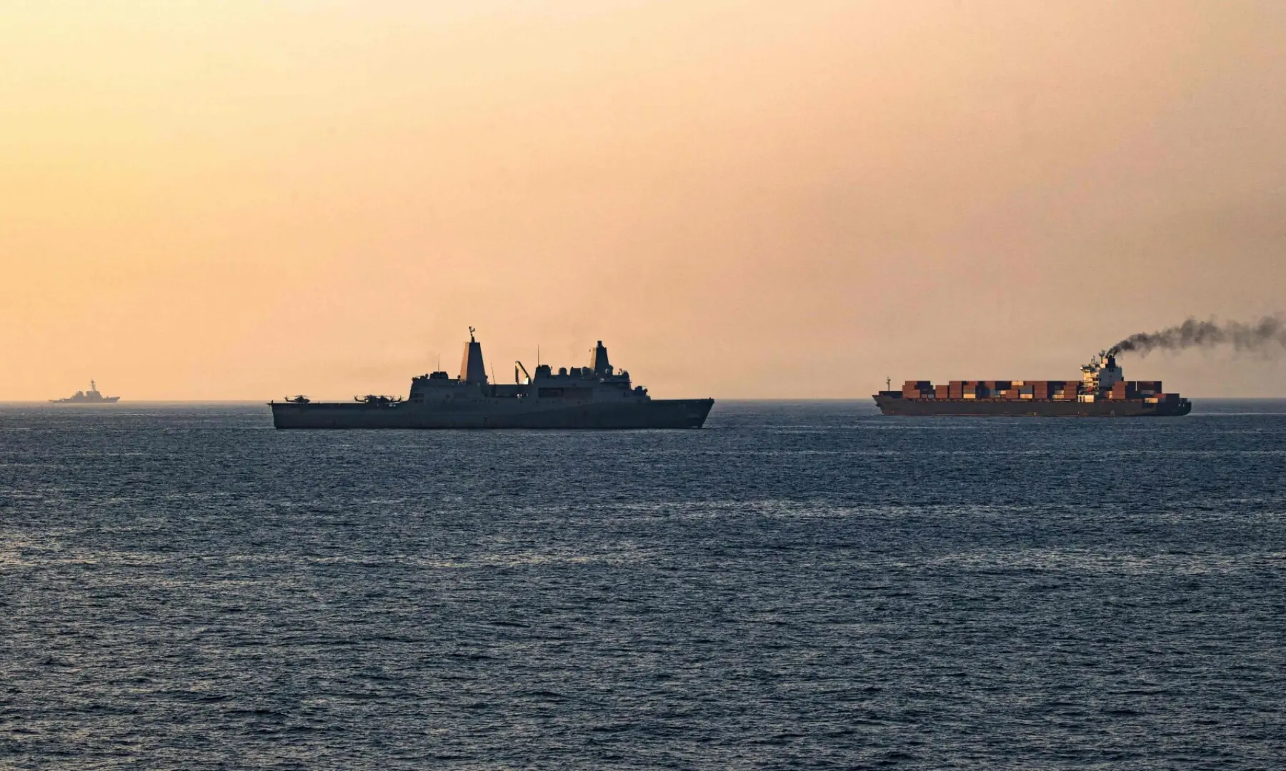 This US Navy handout photograph, released on April 21, 2026, by US Central Command, shows US forces patrolling the Arabian Sea near the Touska, an Iranian-flagged cargo ship, on April 20, 2026. &mdash; AFP