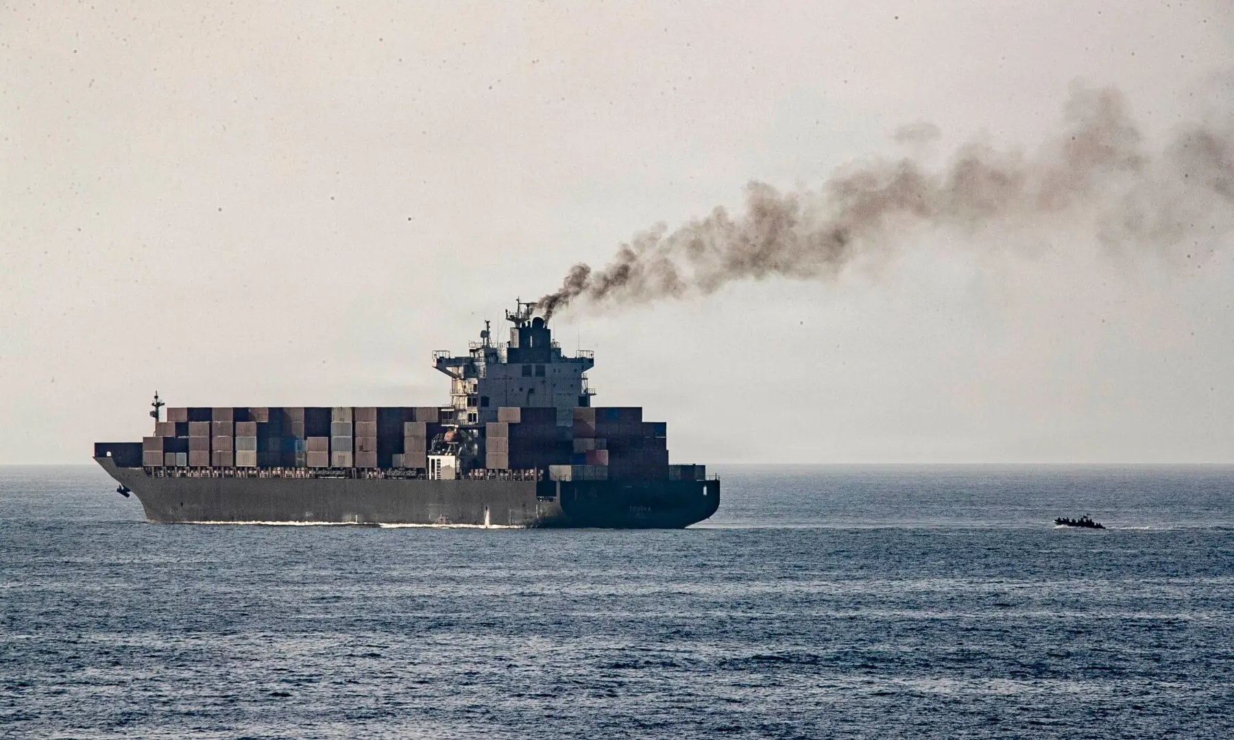 This US Navy handout photograph released on April 21, 2026, by US Central Command, shows US forces patrolling the Arabian Sea near the Touska, an Iranian-flagged cargo ship, on April 20, 2026.  &mdash; AFP