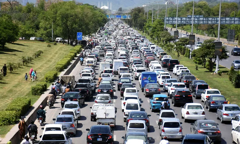 A LONG line of vehicles is seen at the Faizabad entry point on Islamabad Expressway. People are facing longer commute times due to the presence of multiple checkpoints around the capital.—Online A LONG line of vehicles is seen at the Faizabad entry point on Islamabad Expressway. People are facing longer commute times due to the presence of multiple checkpoints around the capital.—Online