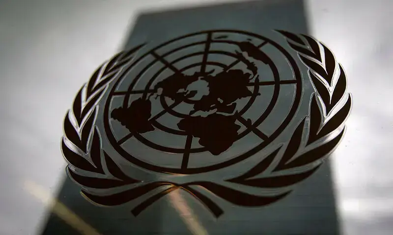 The United Nations headquarters building is pictured though a window with the UN logo in the foreground in the Manhattan borough of New York August 15, 2014. &mdash; Reuters
