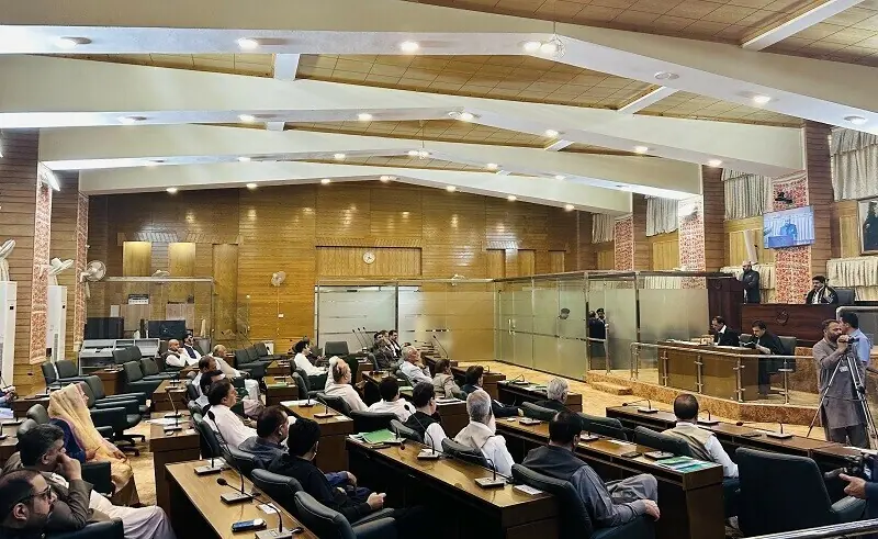 A staff member recites holy verses at the AJK Assembly session. &mdash;Dawn/File