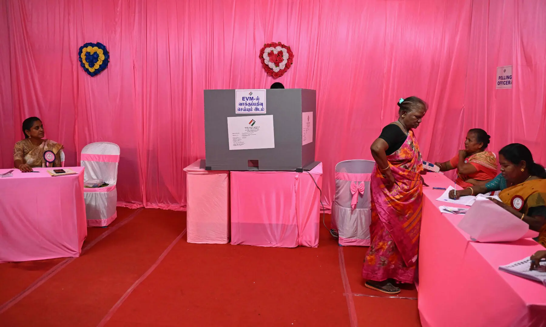 A voter arrives to cast her vote at a pink polling station, an all-women-managed booth, during the Tamil Nadu Legislative Assembly elections in Chennai on April 23, 2026. &mdash; AFP