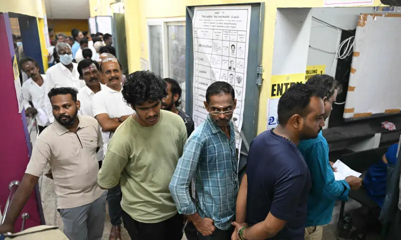 Voters queue to cast their vote outside a polling station during the 2026 Tamil Nadu Legislative Assembly elections in Chennai on April 23, 2026. &mdash; AFP