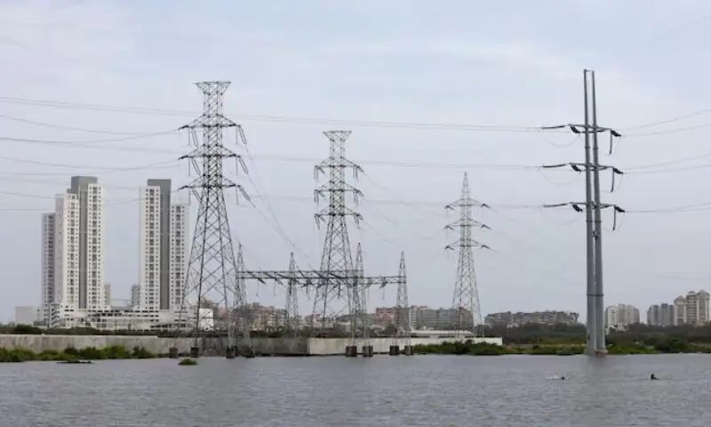 The image shows power transmission towers in Karachi on July 26, 2022. &mdash;Reuters