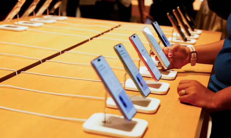 Different mobile phone models displayed at a retail store. &mdash; Reuters/File