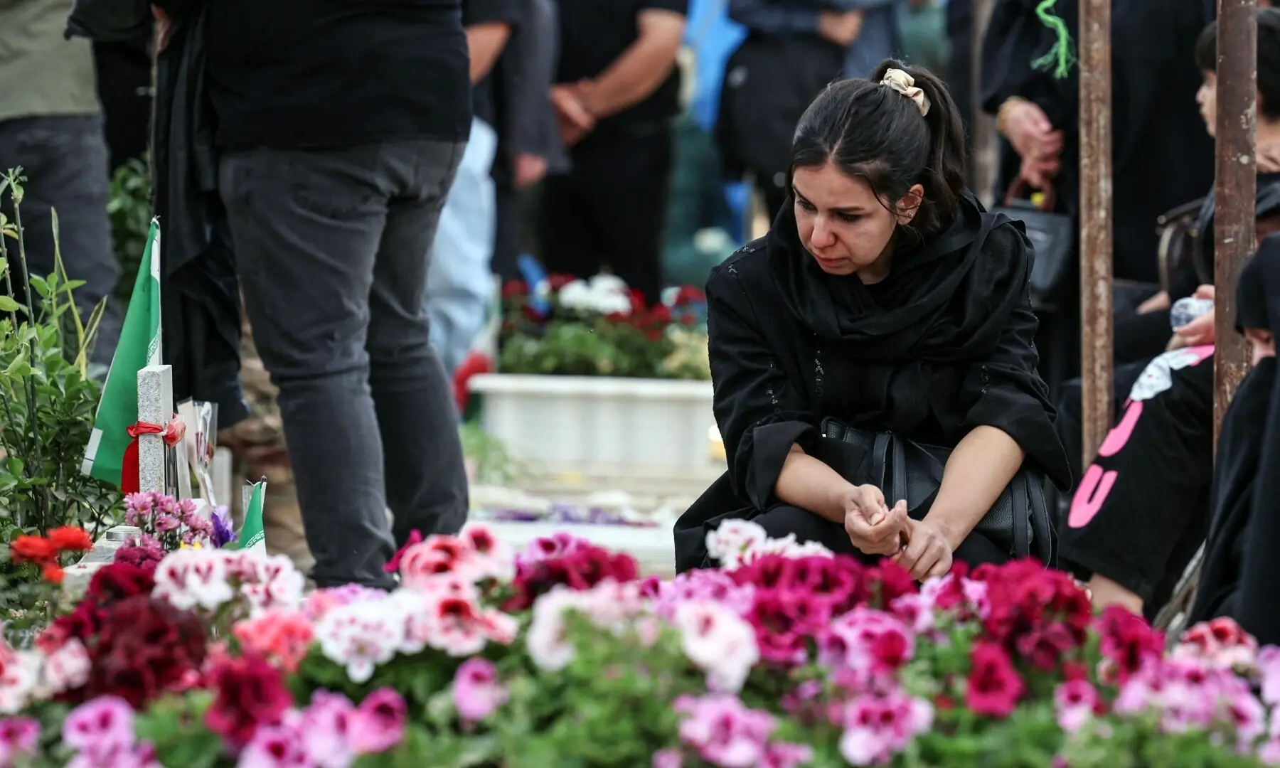 An Iranian woman mourns at the grave of a loved one killed during the US-Israeli war on Iran at the Behesht Zahra Cemetery in southern Tehran on April 23, 2026. &mdash; AFP