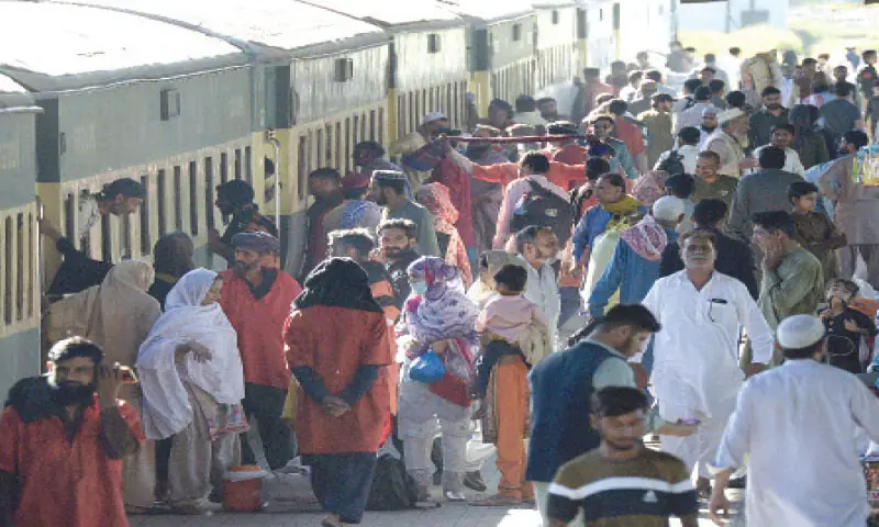 In absence of inter-city public transport, passengers throng Rawalpindi Railway Station on Thursday to catch a train for their hometowns. &mdash; Photo by Mohammad Asim