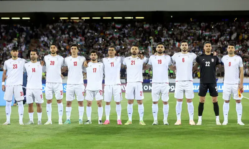 Iran players line up before the match. &mdash; Reuters/File