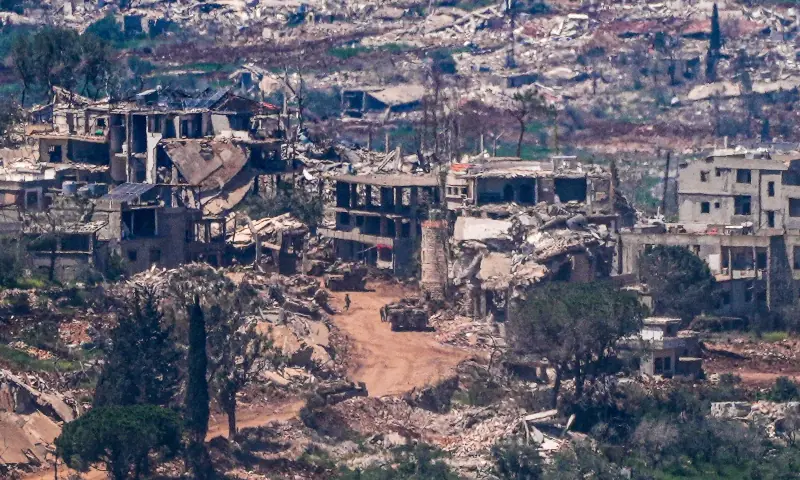 Israeli military vehicles and soldiers in a village in southern Lebanon as the Israeli army operates in it as seen from the Israeli side of the border on April 23, 2026. &mdash; Reuters