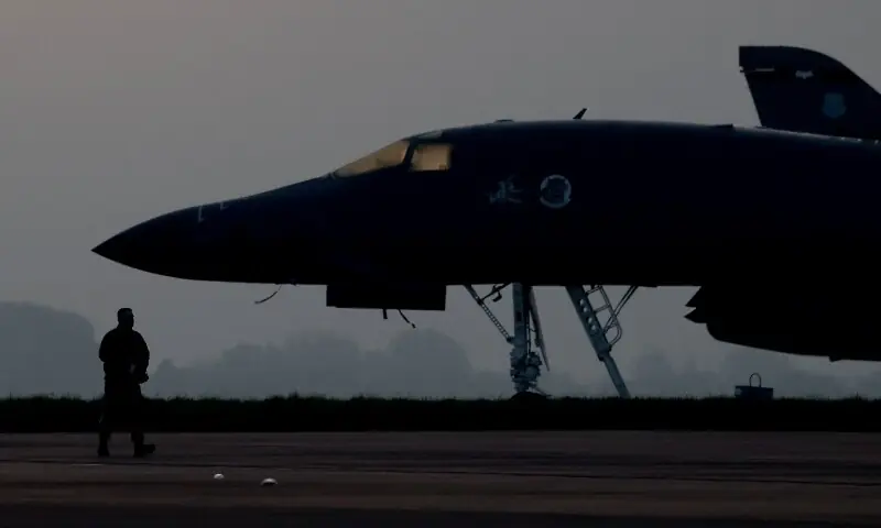 A member of ground crew works next to a B&acirc;&euro;&lsquo;1B Lancer military aircraft at RAF Fairford airbase, which hosts United States Air Force (USAF) personnel, amid a ceasefire between the US and Iran, in Fairford, Gloucestershire, Britain, April 23. &mdash; Reuters