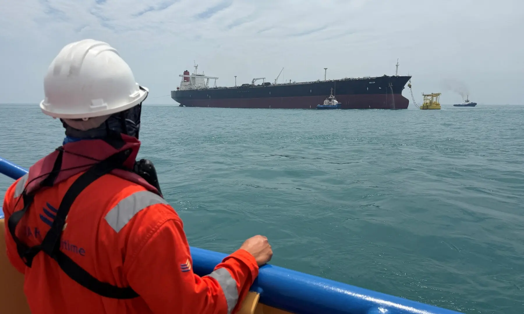 A sailor observes the oil tanker Helga, moored at one of Iraq&rsquo;s southern offshore oil terminals near Basra on April 24, 2026, as it prepares to load crude oil, becoming the second vessel to arrive since the closure of the Strait of Hormuz. &mdash; Reuters