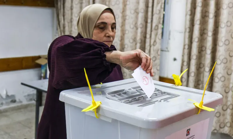 A Palestinian woman casts her ballot at a polling station during municipal elections in the village of al-Badhan, north of Nablus, in the Israeli-occupied West Bank on April 25, 2026. &mdash; AFP