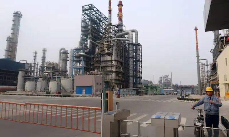 A man is seen at an exit of the refinery plants of Chambroad Petrochemicals in Binzhou, Shandong province, China on October 24, 2019. &mdash;Reuters/File