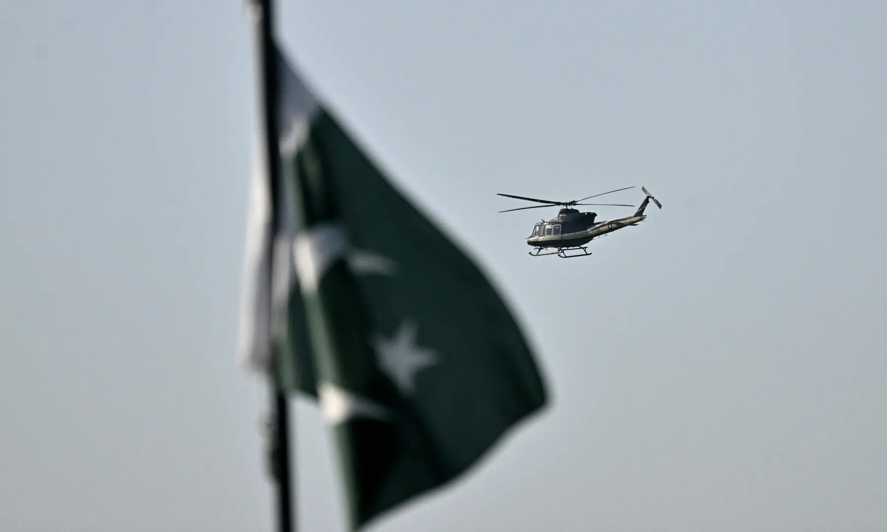 A helicopter flies over the Red Zone area of Islamabad on April 25, 2026. &mdash; AFP