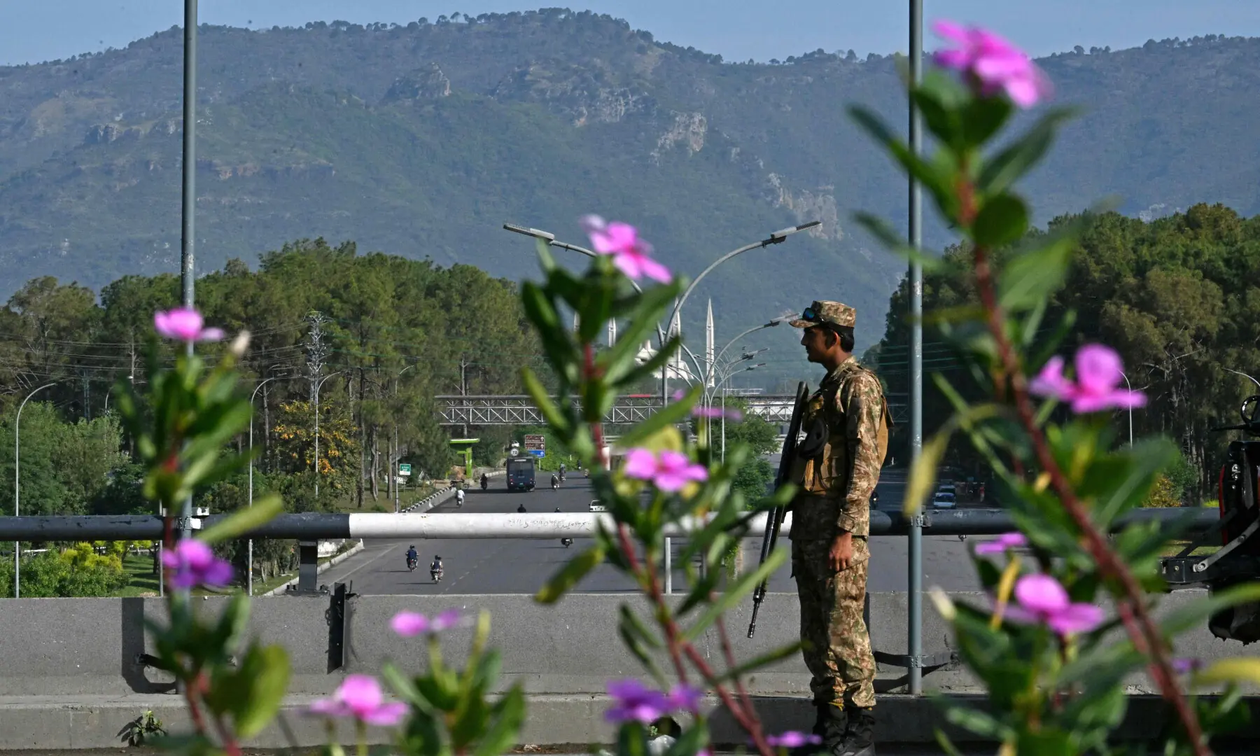 An army trooper stands guard at a closed road in the Red Zone area of Islamabad on April 25, 2026. &mdash; AFP
