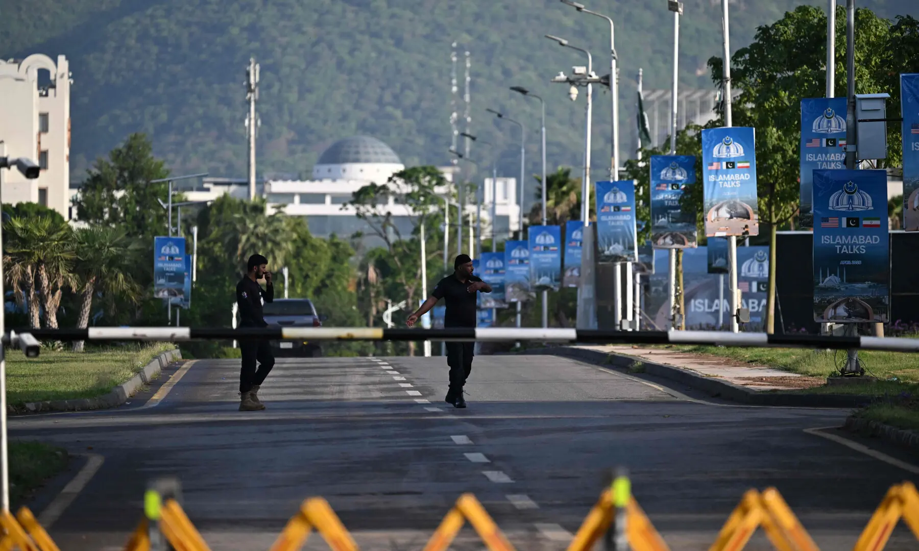 Police officers walk near the Serena Hotel, the venue for expected US-Iran talks, in Islamabad&rsquo;s Red Zone on April 25, 2026. &mdash; AFP