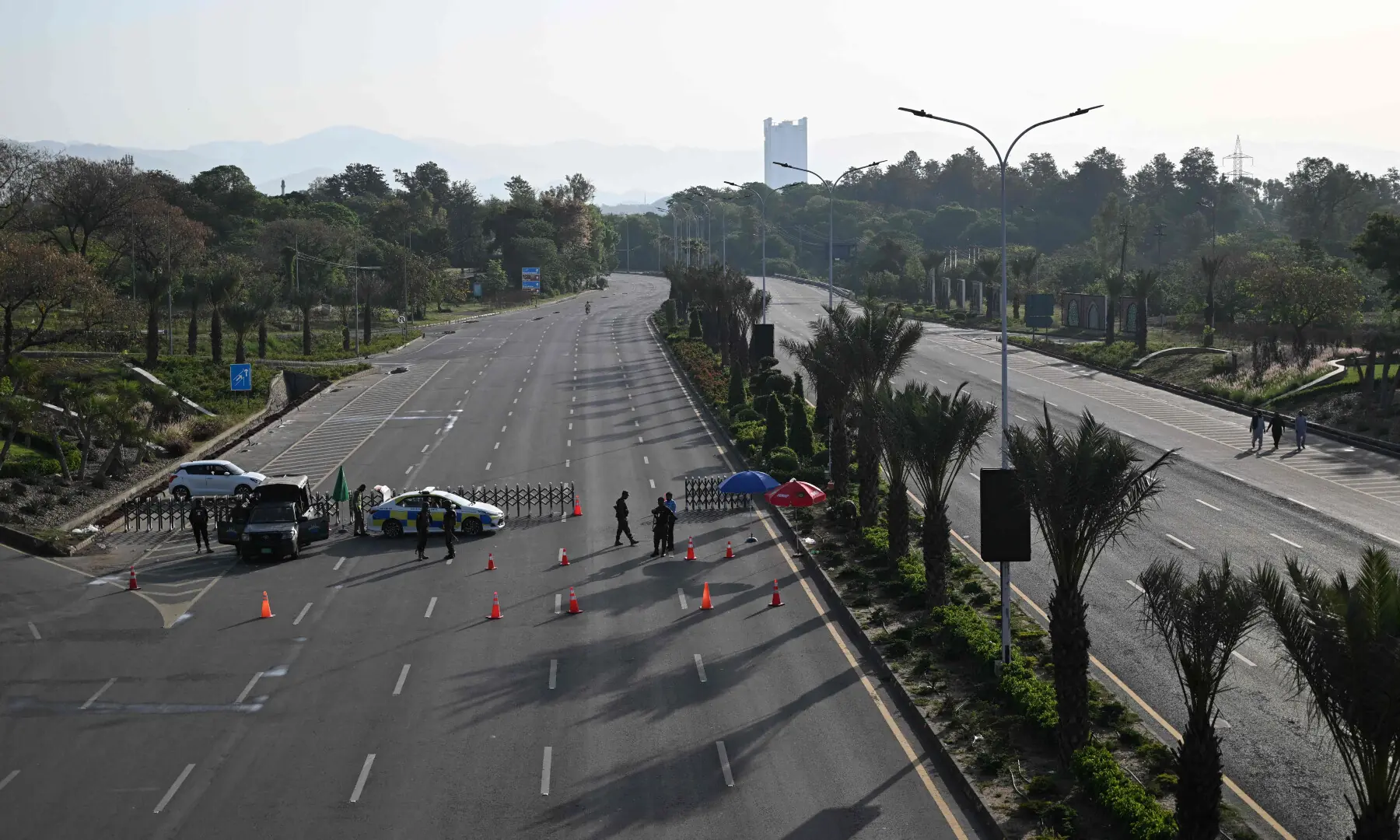 Police officers stand guard at a closed thoroughfare leading to the Serena Hotel, the venue for expected US-Iran talks, in Islamabad&rsquo;s Red Zone on April 25, 2026. &mdash; AFP