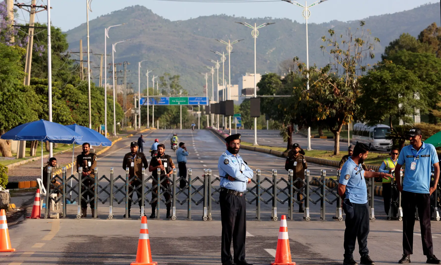 Police officers stand guard next to a barricade near Serena Hotel, as Pakistan prepares to host the US and Iran for the expected second round of peace talks, in Islamabad, on April 25, 2026. &mdash; Reuters