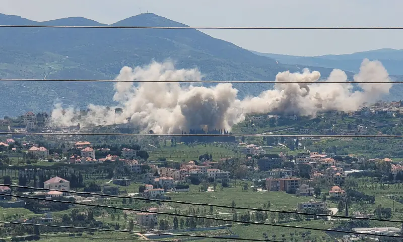 Smoke billows from explosions in the southern Lebanese village of Khiam on April 25, 2026, where the Israeli army has detonated residential homes. &mdash; Reuters