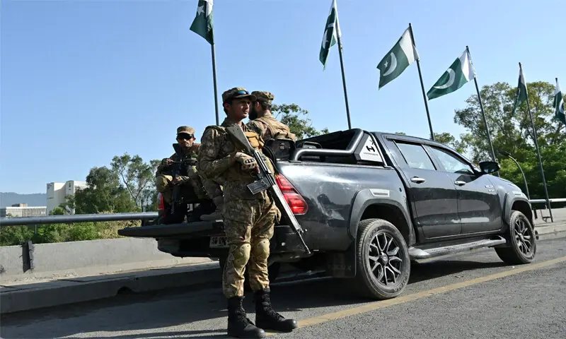 Army personnel keep watch along a closed road in the Red Zone area of Islamabad.&mdash; AFP