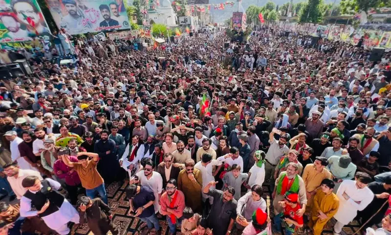 PTI supporters listen to a speech by Khyber Pakhtunkhwa Chief Minister Sohail Afridi (not seen in the picture) at a rally held in connection with the party&rsquo;s &lsquo;street movement&rsquo; at Muzaffarabad&rsquo;s Lal Chowk on Saturday. &mdash; Photo by Tariq Naqash