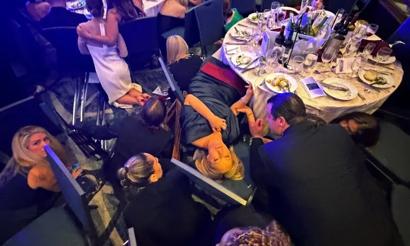 Guests take cover after U.S. President Donald Trump and first lady Melania Trump were rushed out of the White House Correspondents&rsquo; Association dinner by Secret Service agents when a man opened fire with a shotgun on security personnel outside the room, in Washington, DC, US April 25. &mdash; Reuters