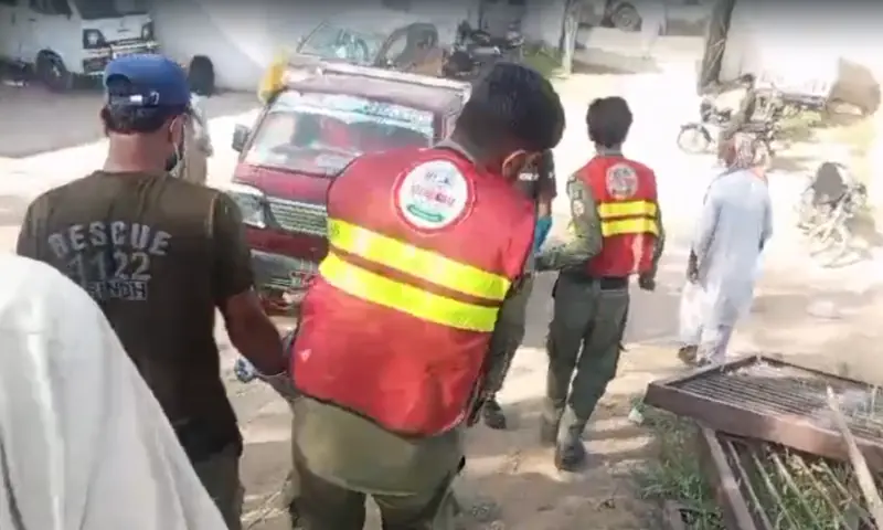 Rescuers carry the body of a boy who drowned after being swept away while swimming in a major water line in Scheme 33, Karachi on April 26, 2026. &mdash; screengrab from video via author