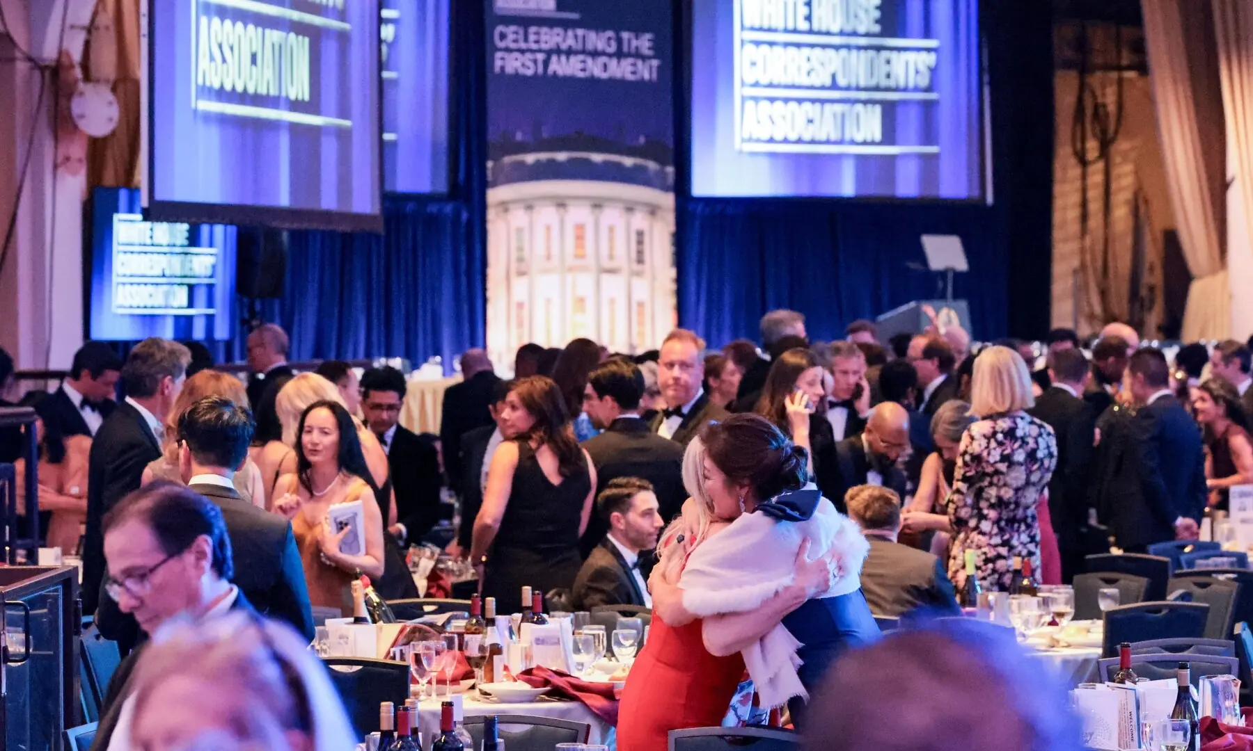 Guests embrace following a shooting incident during the annual White House Correspondents&acirc;&euro;&trade; Association dinner in Washington, DC, US, April 25. &mdash; Reuters