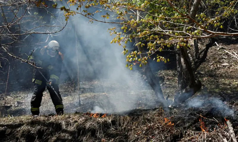 A firefighter works as wildfires continue in Otsuchi, Iwate Prefecture, Japan on April 26, 2026. &mdash; Reuters