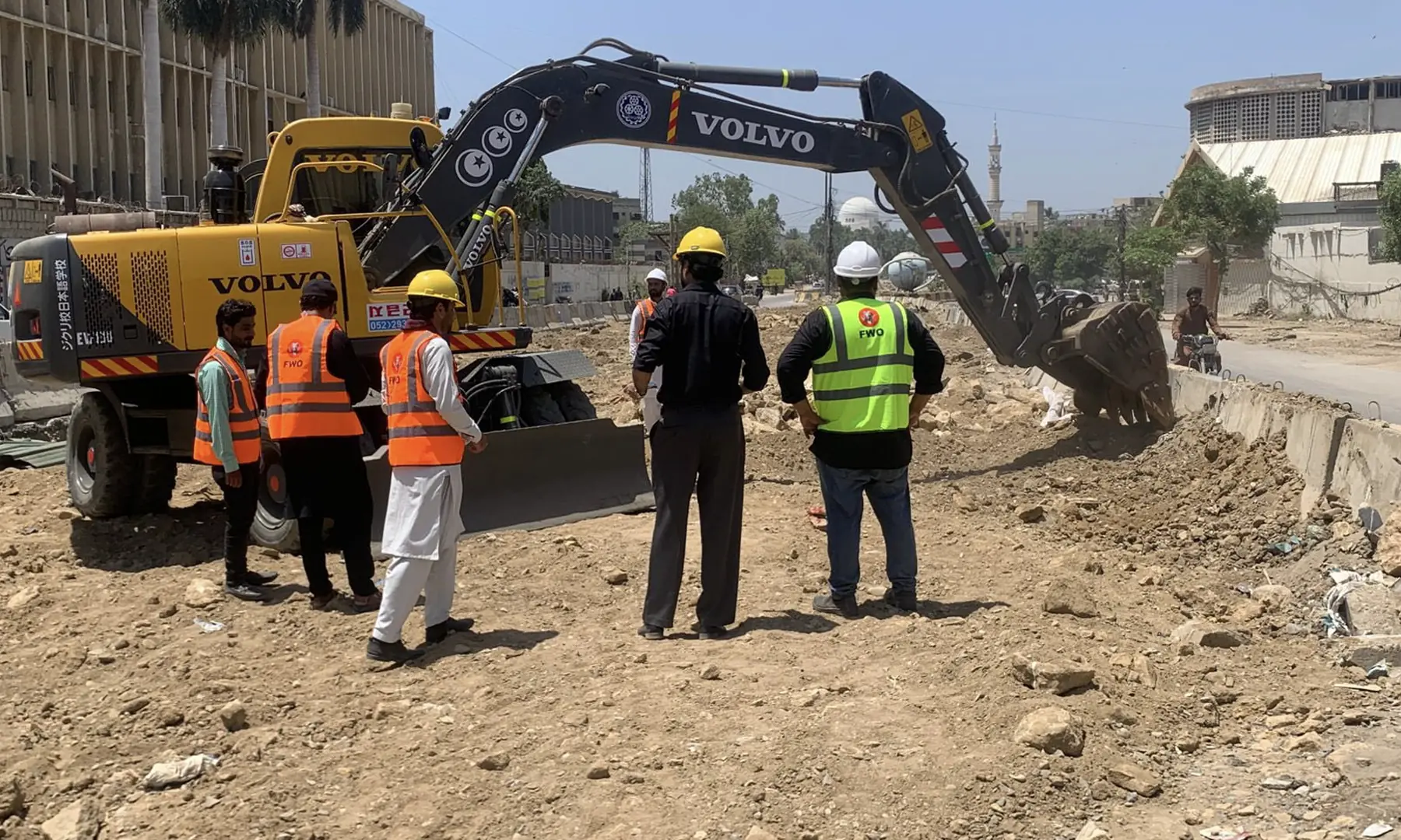 Construction workers photographed at the site of BRT Red Line project on Karachi's University Road on April 26. &mdash; Photo courtesy Murtaza Wahab/X