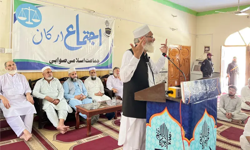 Jamaat-i-Islami former chief Sirajul Haq addresses a gathering in Swabi on Sunday. &mdash; Dawn