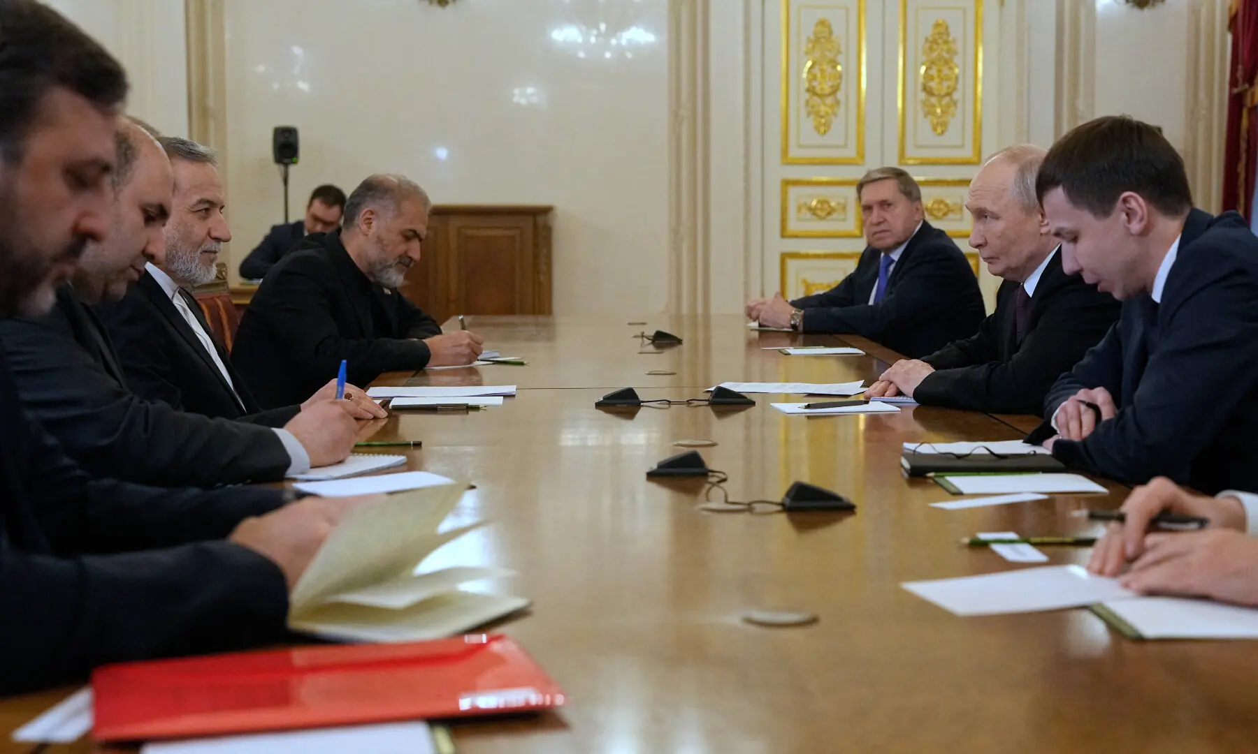 Russian President Vladimir Putin and Iranian Foreign Minister Abbas Araqchi attend a meeting at the Boris Yeltsin Presidential Library in Saint Petersburg, Russia on April 27, 2026. &mdash; Reuters