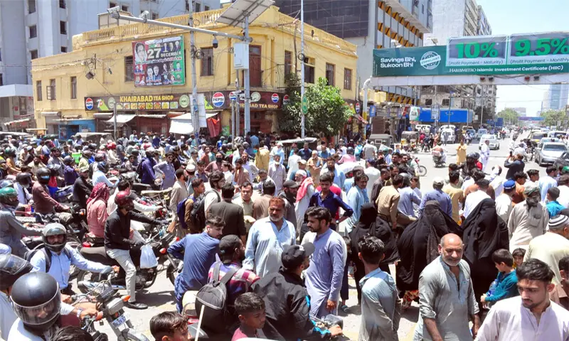 A large number of people gather near Shaheen Complex and block the I.I. Chundrigar Road in protest over prolonged loadshedding in nearby Railway Colony.&mdash;Online