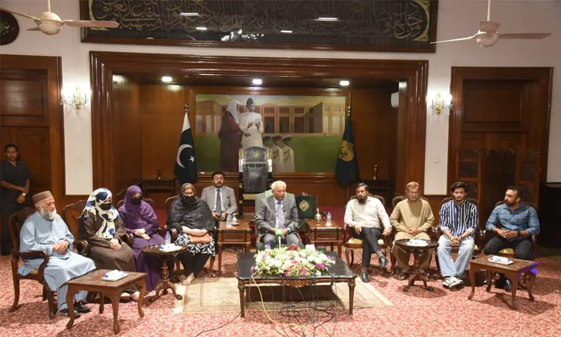 Governor Nehal Hashmi speaks at the press conference, alongside members of the families of abducted oil tanker crew.&mdash;Dawn