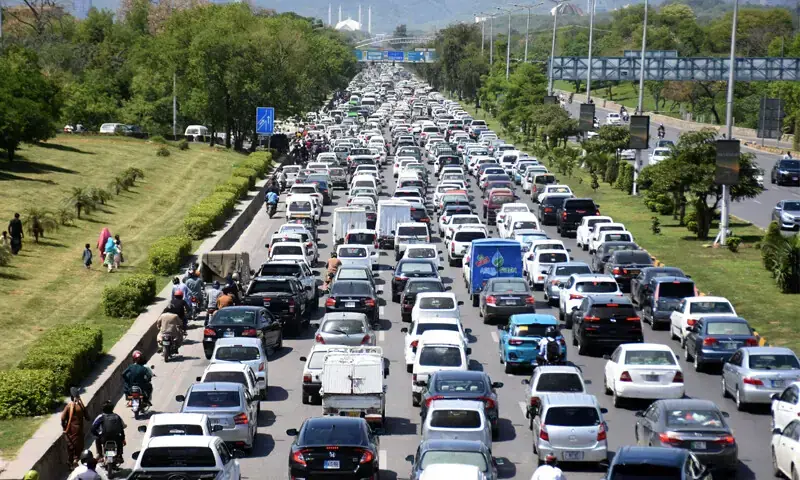 A LONG line of vehicles is seen at the Faizabad entry point on Islamabad Expressway. People are facing longer commute times due to the presence of multiple checkpoints around the capital.&mdash;Online