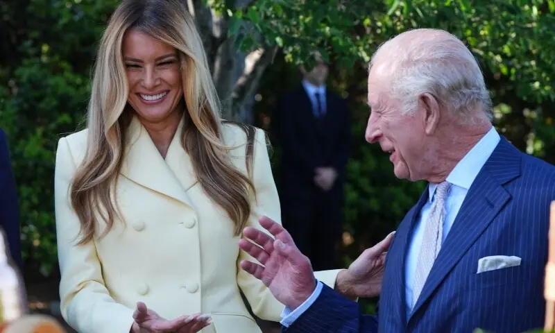 irst Lady Melania Trump laughs with Britain&rsquo;s King Charles III as they tour the White House Beehive on the South Lawn of the White House in Washington, DC, on April 27, 2026. &mdash;AFP