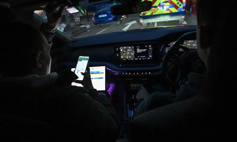 Police officer Hayley Carr (L) navigates as police officer Hayden O&rsquo;Connor (R) drives a Metropolitan Police interceptor vehicle towards the scene of a mobile phone theft in central London April 25. &mdash; AFP
