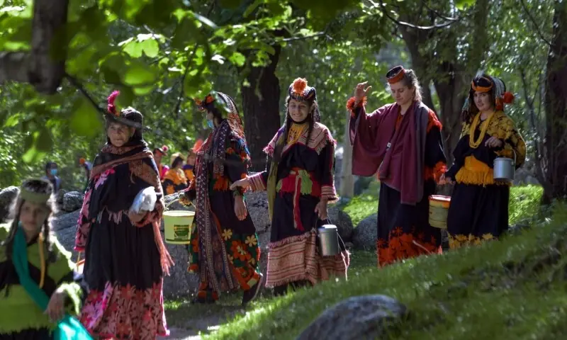 This image shows Kalash women wearing traditional clothes. &mdash; Photo by Abdul Majeed Goraya