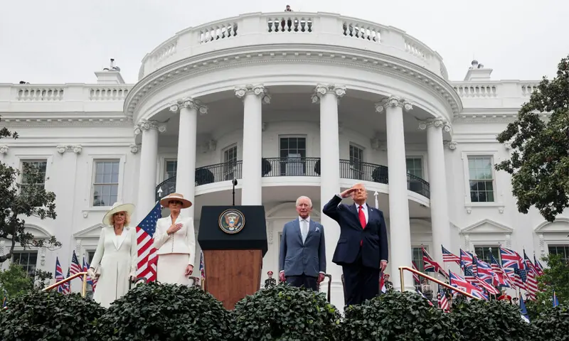 President Donald Trump salutes next to Britain&rsquo;s King Charles III, first lady Melania Trump and Queen Camilla, during a ceremony on the South Lawn of the White House.&mdash;Reuters